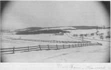 SA0362 - Photo showing a barn, fields, the snow, and fencing. Identified on the front., Winterthur Shaker Photograph and Post Card Collection 1851 to 1921c